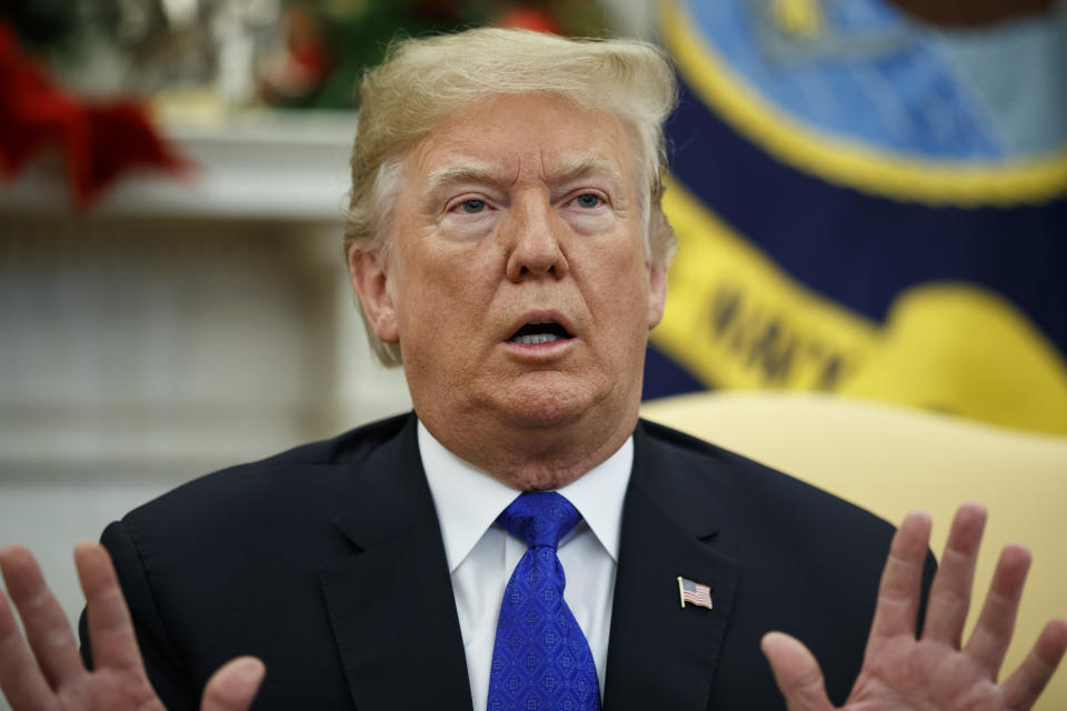 In this Dec. 11, 2018 photo, President Donald Trump speaks during a meets with Democratic leaders the Oval Office in Washington. Trump said last week he would be "proud" to have a shutdown to get Congress to approve a $5 billion down payment to fulfill his campaign promise to build a border wall. (AP Photo/Evan Vucci)