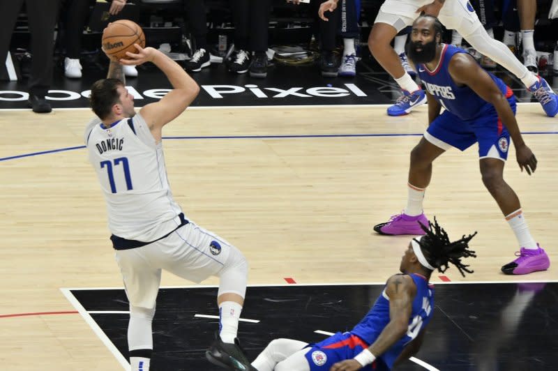 Dallas Mavericks guard Luka Doncic (L) led the NBA in points per game this season. File Photo by Jim Ruymen/UPI