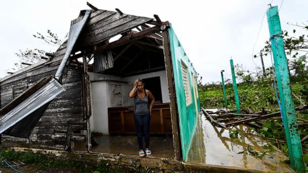 PHOTO: Caridad Alvarez stands in her house destroyed by Hurricane Ian, in San Juan y Martinez, Pinar del Rio Province, Cuba, Sept. 27, 2022. (Adalberto Roque/AFP via Getty Images)