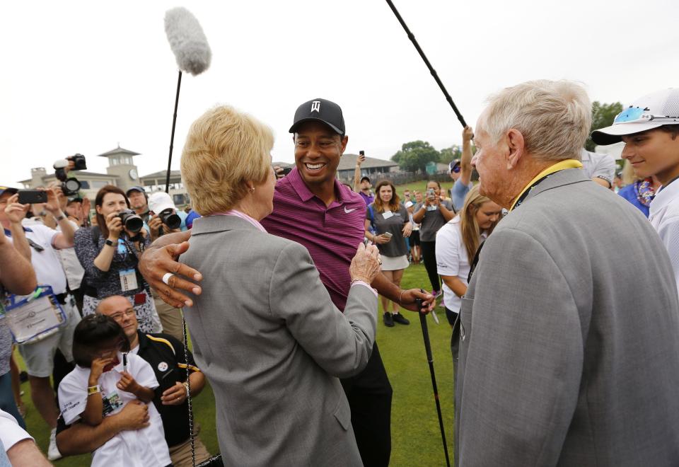 Tiger Woods hugs Barbara Nicklaus beside Jack Nicklaus before the 2018 Memorial Tournament.