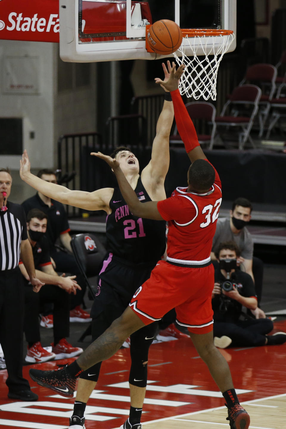 Ohio State's E.J. Liddell, right, tries to shoot over Penn State's John Harrar during the second half of an NCAA college basketball game Wednesday, Jan. 27, 2021, in Columbus, Ohio. Ohio State beat Penn State 83-79. (AP Photo/Jay LaPrete)