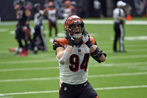 Cincinnati Bengals defensive end Sam Hubbard (94) celebrates after forcing a fumble by Houston Texans quarterback Deshaun Watson during the second half of an NFL football game Sunday, Dec. 27, 2020, in Houston. The Bengals recovered the fumble and beat the Texans 37-31. (AP Photo/Eric Christian Smith)