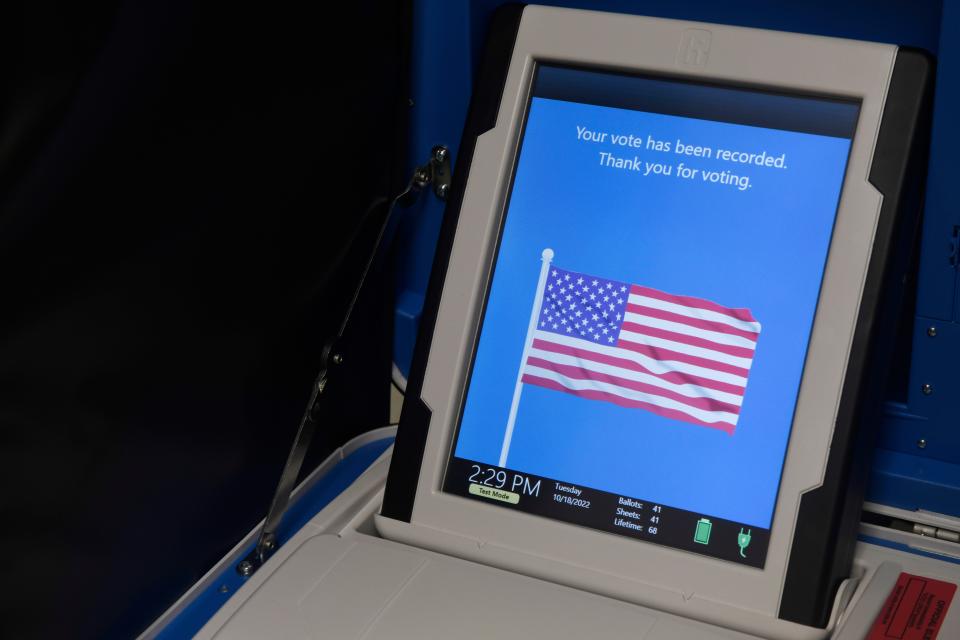 Voters will walk over to the insertion machine and insert their paper ballot, as seen Tuesday, Oct. 18, 2022. The ballot boxes are locked and have multiple seals on the locks to prevent tampering. 