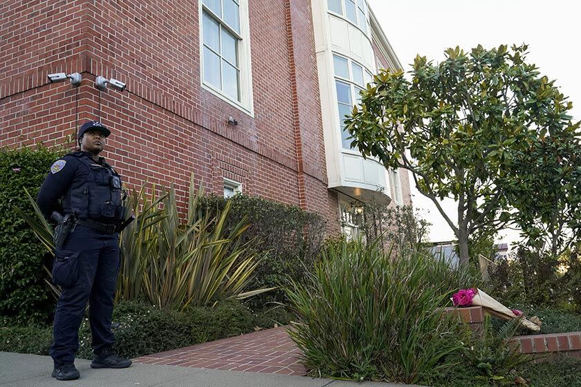 An officer outside the home of Paul Pelosi, the husband of House Speaker Nancy Pelosi, in San Francisco.