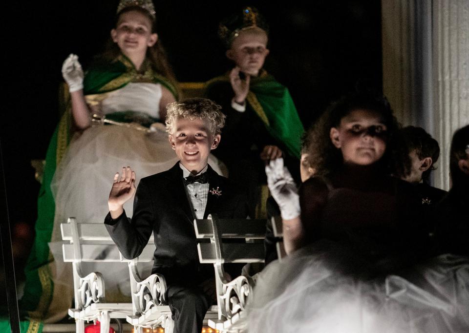 Emerson Carr, center, waves to the crowd during the Edison Festival of Light Grand Parade on Saturday, Feb. 17, 2024, in Fort Myers.