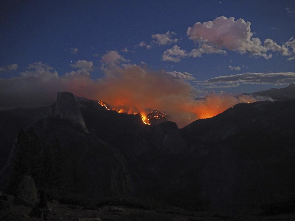 The Meadow Fire burns near Half Dome in Yosemite National Park, California, in this handout photo released to Reuters on September 8, 2014. The so-called Meadow Fire, which flared out of control on Sunday afternoon, stranded 85 hikers on top of Half Dome, the park's signature rock formation, requiring them to be flown out by helicopter, Yosemite spokeswoman Ashley Mayer said. (REUTERS/Jeffrey Trust/National Park Service)