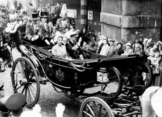 <p>United Press Photo/SuperStock/Alamy Stock Photo</p> Queen Elizabeth and Prince Philip travel by carriage through Edinburgh, Scotland on June 24, 1953.