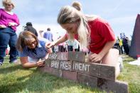 <p>Protesters against the U.K. visit of President Trump build a “baby wall” outside his golf course, Trump International Golf Links near Aberdeen, Scotland, on July 14, 2018, during the private part of his four-day U.K. visit. (Photo: Michal Wachucik/AFP/Getty Images) </p>