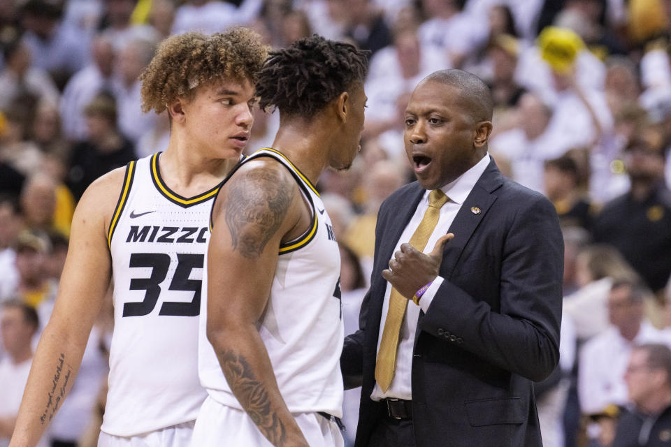 Missouri head coach Dennis Gates, right, talks to Noah Carter, left, and DeAndre Gholston during the second half of an NCAA college basketball game against Mississippi Saturday, March 4, 2023, in Columbia, Mo. Missouri won 82-77. (AP Photo/L.G. Patterson)