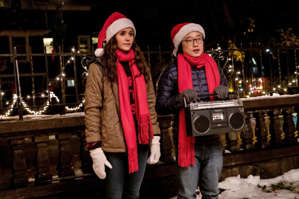 Natalie (Nina Dobrev) and Josh (Jimmy O. Yang) pretend to be a holiday couple in the romantic comedy "Love Hard."