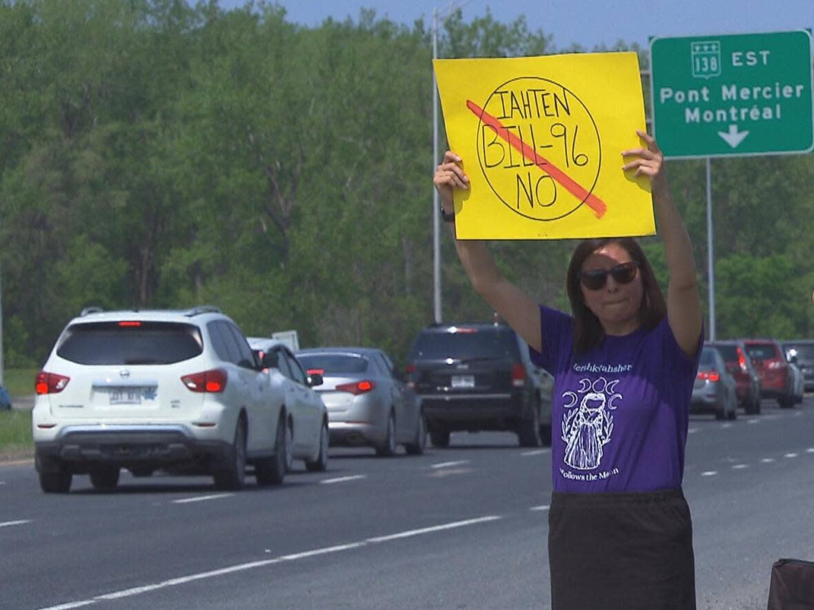 Dozens from Kahnawake stopped traffic on the Mercier bridge on Saturday, saying they're worried Bill 96 will be a setback for the community struggling to keep its language alive.   (CBC News - image credit)