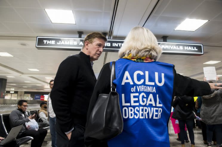 An ACLU legal observer stands with Rep. Don Beyer.