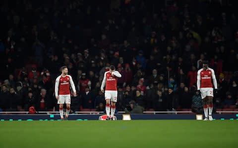 Arsenal's players walk back to centre - Credit: Reuters