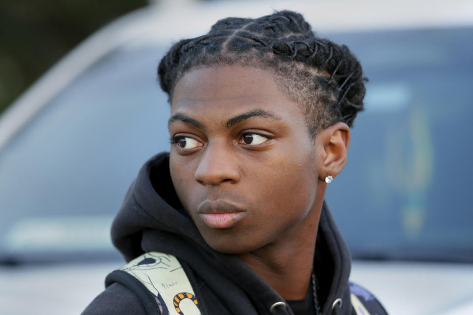 FILE - Darryl George, an 18-year-old junior looks on before walking into Barbers Hill High School after serving an in-school suspension for not cutting his hair Monday, Sept. 18, 2023, in Mont Belvieu, Texas. George will be sent to EPIC, an alternative school program, from Oct. 12 through Nov. 29 for “failure to comply” with multiple campus and classroom regulations, the principal said in a Wednesday, Oct. 11, letter provided to The Associated Press by the family. (AP Photo/Michael Wyke, File)