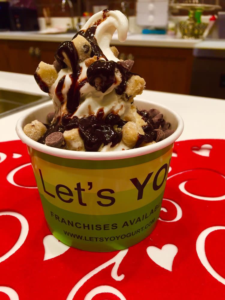 Cup of frozen yogurt with toppings from Let’s Yo!