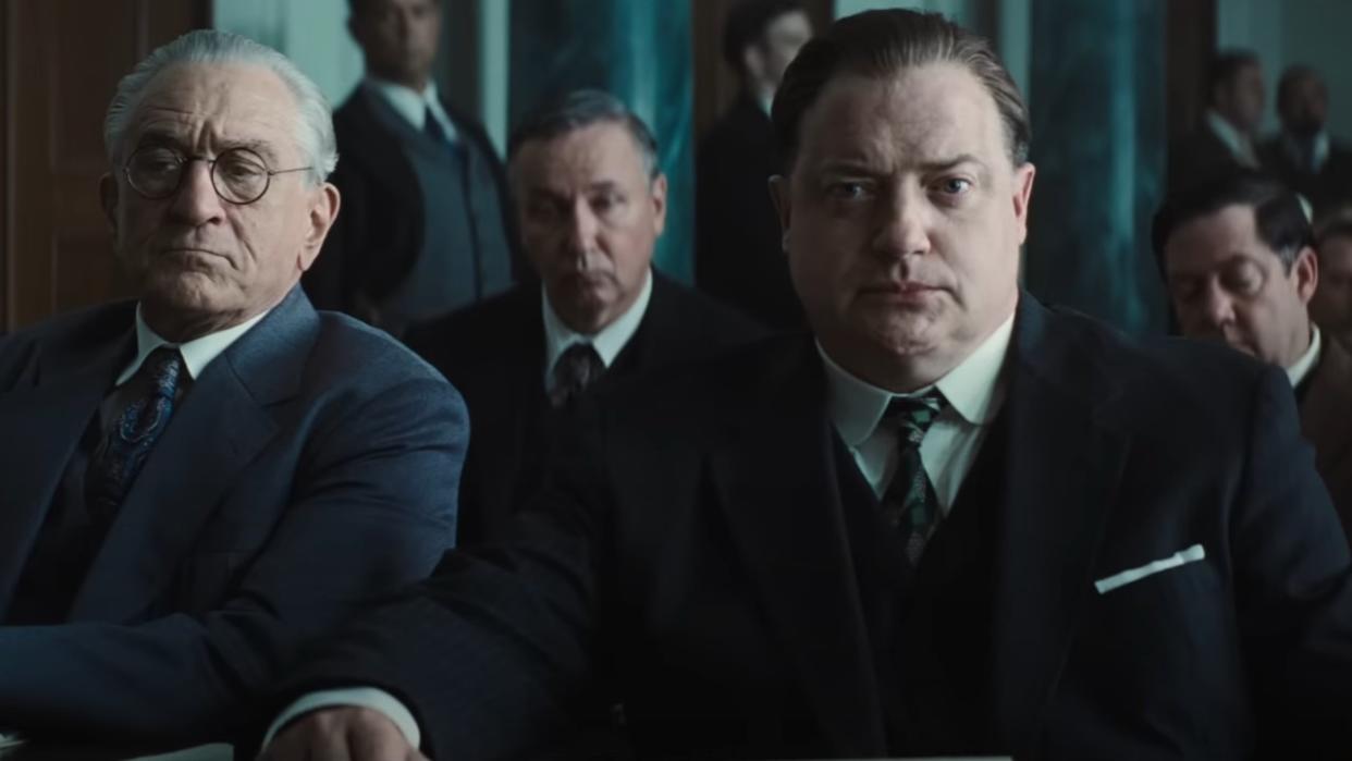  A screenshot of (from left to right) Robert De Niro and Brendan Fraser sitting next to each other in court in Killers of the Flower Moon. 