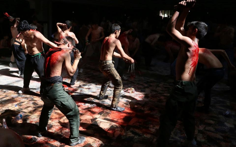 Shia Muslims men sometimes flail themselves with bladed-chains or cut their foreheads in rituals during the religious festival of Ashura - AP