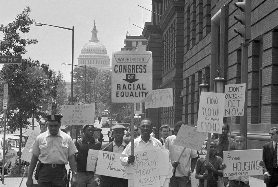 FILE - Demonstrators march down North Capital Street during protest march within sight of the capitol in Washington, June 14, 1963. They’re hallmarks of American history: protests, rallies, sit-ins, marches, disruptions. They date from the early days of what would become the United States to the sights and sounds currently echoing across the landscapes of the nation’s colleges and universities. (AP Photo/John Rous, File)