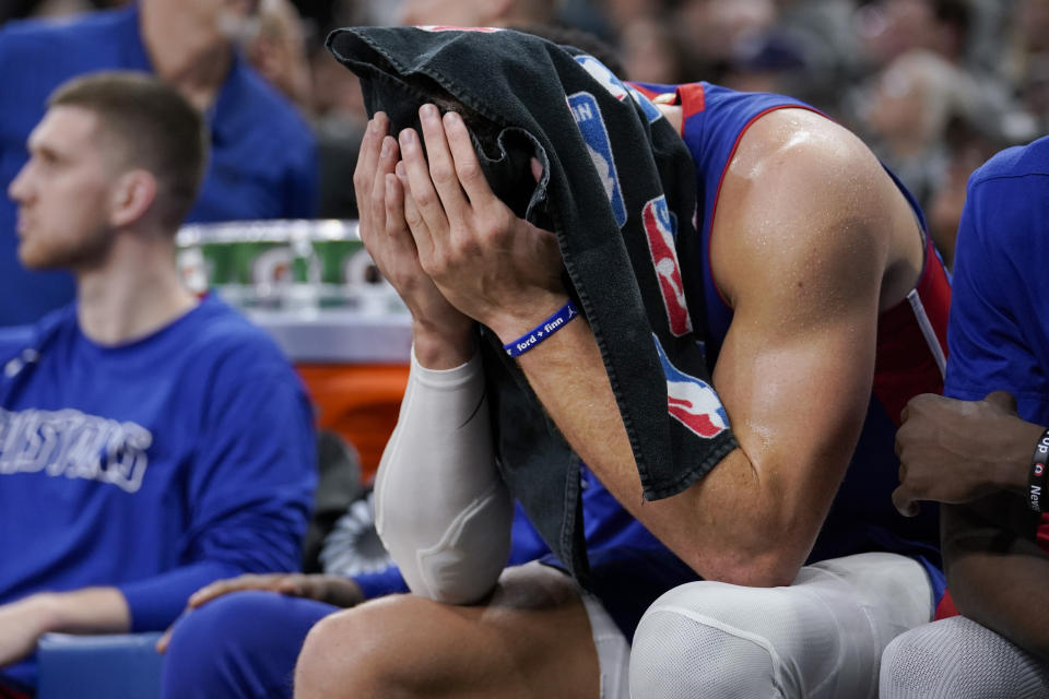 Detroit Pistons forward Blake Griffin sits on the bench during the second half of the team's NBA basketball game against the San Antonio Spurs, Saturday, Dec. 28, 2019, in San Antonio. San Antonio won 136-109. (AP Photo/Darren Abate)
