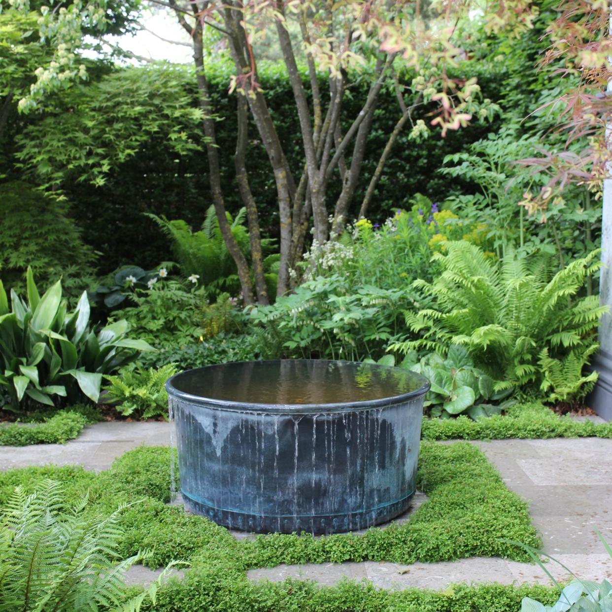  A black water tub feature at RHS Chelsea Flower Show. 