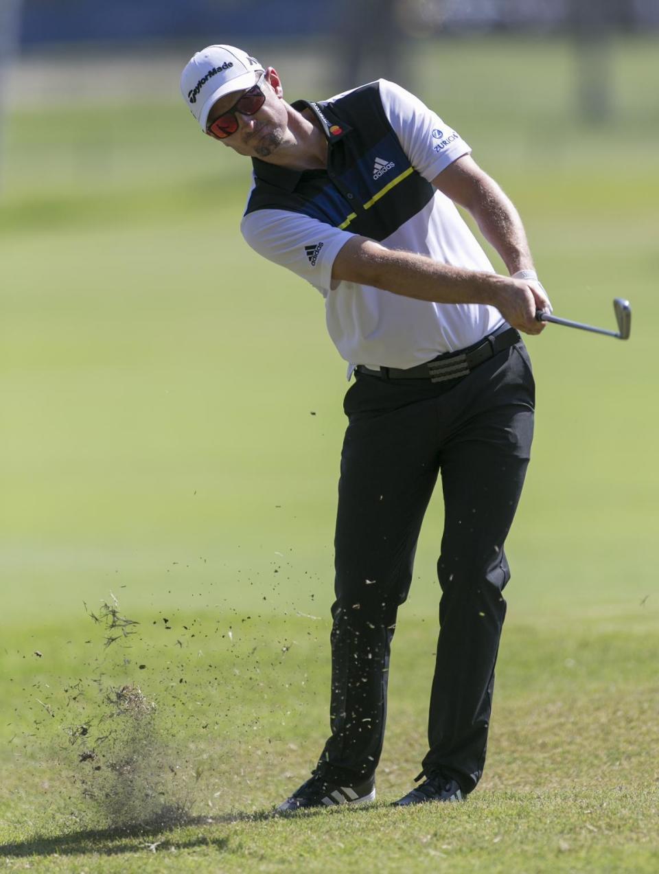 Justin Rose, of England, hits on the third fairway during the final round of the Sony Open golf tournament, Sunday, Jan. 15, 2017, in Honolulu. (AP Photo/Marco Garcia)