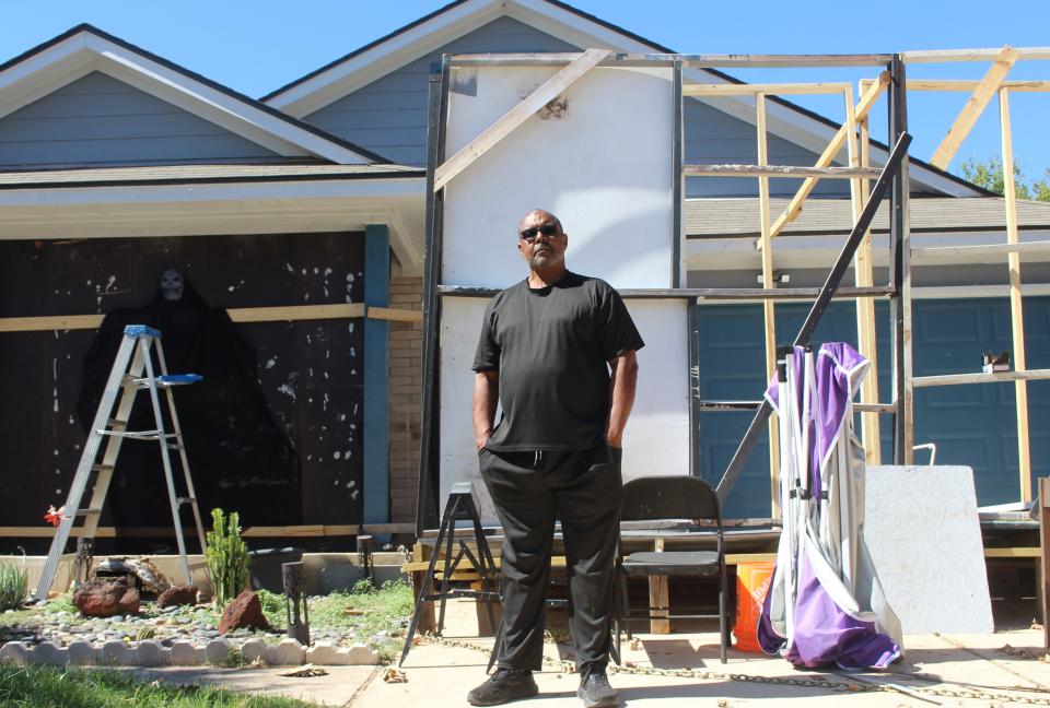 Richard Franklin, a longtime resident of Austin’s Colony, takes a break from building a haunted house in front of his home Saturday. Franklin hopes the community can organize to demand a response from SouthWest Water Co. about poor water quality.