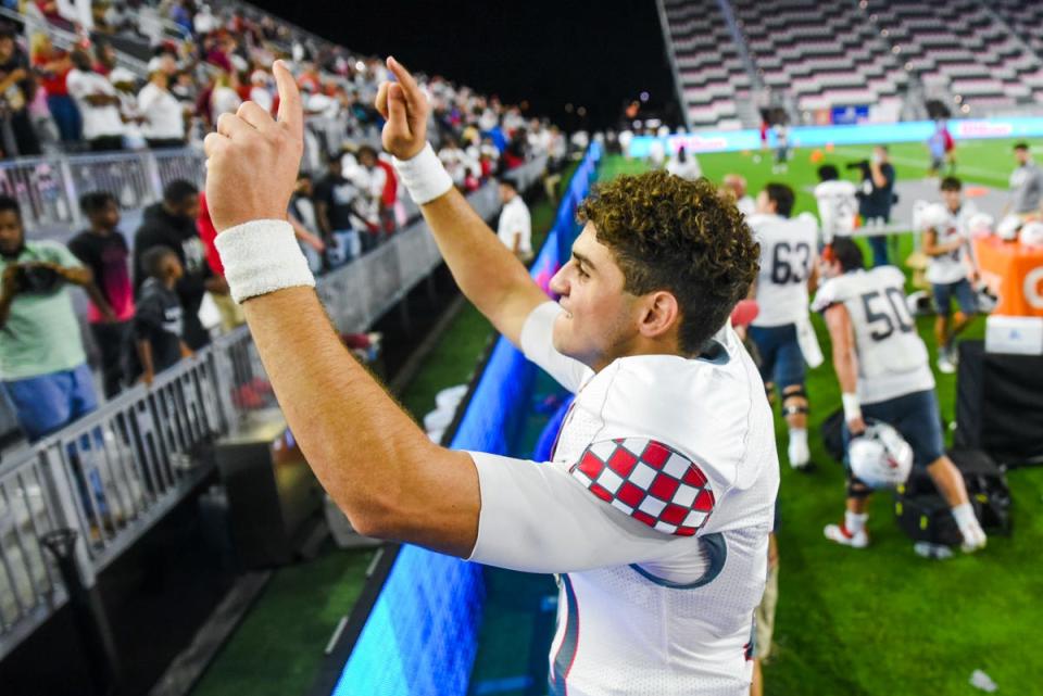 Gibbons quarterback Dylan Rizk (10) waves to fans after winning during the Class 4A State Championship game between Cardinal Gibbons and Cocoa Beach at DRV PNK Stadium in Fort Lauderdale, FL., on Thursday, December 16, 2021. Final score, Gibbons 21, Cocoa, 19.