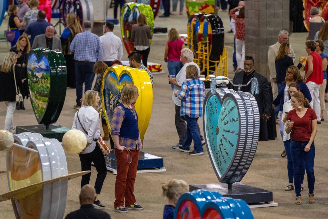 Visitors gather to see the Parade of Hearts reveal kickoff event Friday at the American Royal complex.