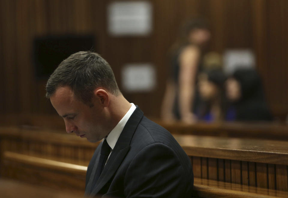 Oscar Pistorius sits in the dock in court of his murder trial in Pretoria, South Africa, Tuesday, March 25, 2014. Pistorius is charged with the Valentines Day 2013 shooting death of his girlfriend Reeva Steenkamp. (AP Photo/Esa Alexander, Pool)