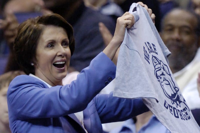 Then-Speaker of the House Nancy Pelose holds a Georgetown University T-shirt that she was presented with when she attended a NCAA basketball game between the Notre Dame Fighting Irish and the Georgetown Hoyas on January 6, 2007, at the Verizon Center in Washington, D.C. On January 23, 1789, Georgetown University was founded in Georgetown, Md., which later would be part of the District of Columbia. It was originally called Georgetown College. File Photo by Mark Goldman/UPI