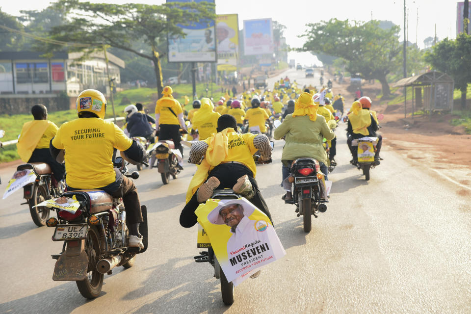 Supporters of Ugandan President Yoweri Kaguta Museveni celebrate, in Kampala, Uganda, Saturday Jan. 16, 2021, after their candidate was declared winner of the presidential elections. Uganda’s electoral commission says longtime President Yoweri Museveni has won a sixth term, while top opposition challenger Bobi Wine alleges rigging and officials struggle to explain how polling results were compiled amid an internet blackout. In a generational clash widely watched across the African continent, the young singer-turned-lawmaker Wine posed arguably the greatest challenge yet to Museveni. (AP Photo/Nicholas Bamulanzeki)