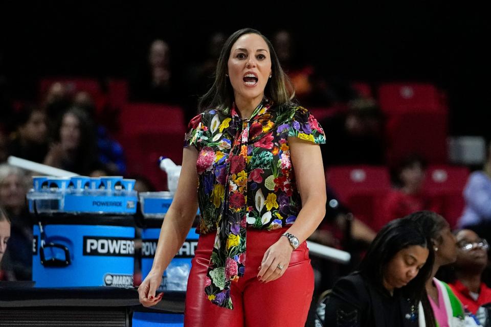 Arizona head coach Adia Barnes talks to her team against Maryland during the first half of a second-round college basketball game in the NCAA Tournament, Sunday, March 19, 2023, in College Park, Md. (AP Photo/Julio Cortez)