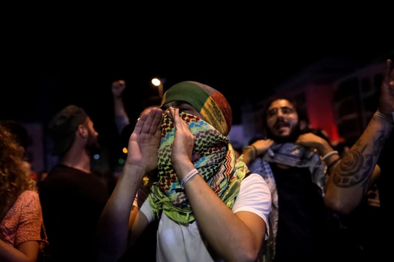 A man shouts slogans during a demonstration following a broadcasted interview by Lebanese President Michel Aoun, during ongoing anti-government protests in Beirut