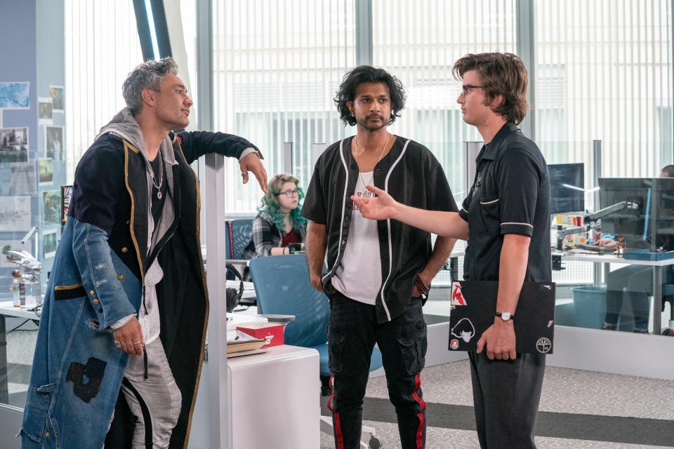 Software mogul Antwan (Taika Waititi, far left) holds sway over employees like Mouser (Utkarsh Ambudkar) and Keys (Joe Keery) in "Free Guy."