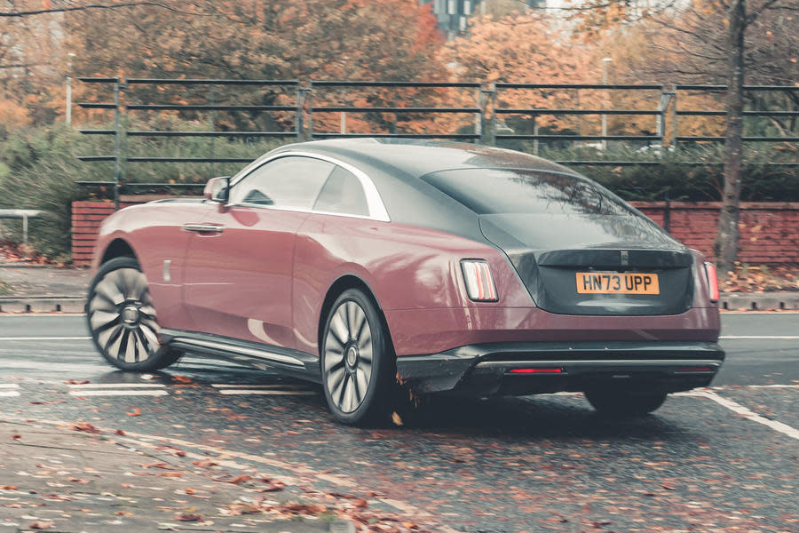 Rolls-Royce Spectre turning left out of give way line