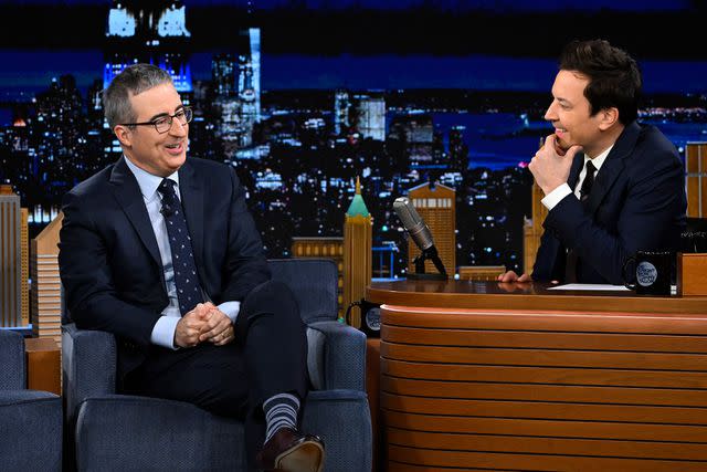 <p>Todd Owyoung/NBC via Getty</p> John Oliver and Jimmy Fallon