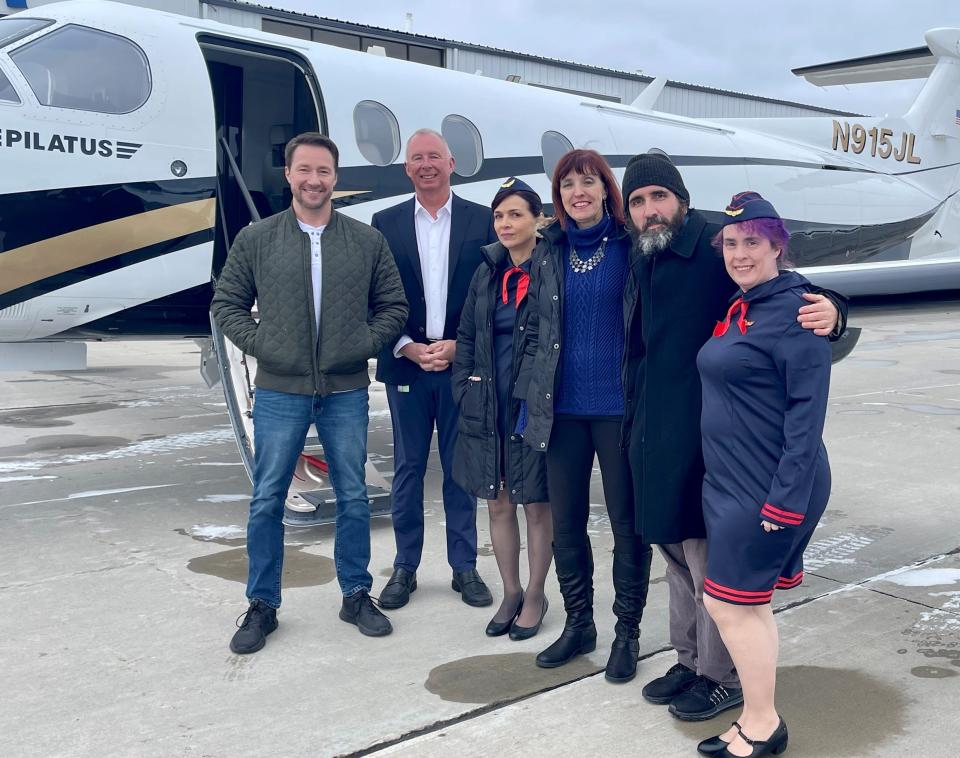 Recent filming for "Room 108: The Clearing" included going up in the plane of Pete Dorsch, second from left, and shooting scenes at Jet Air Group in Ashwaubenon. Cast members include, from left, Tony Lee Gratz, Melonie Gartner, Linda Felten, Freddy Moyano, who is also the director, and Jolee Jackson.