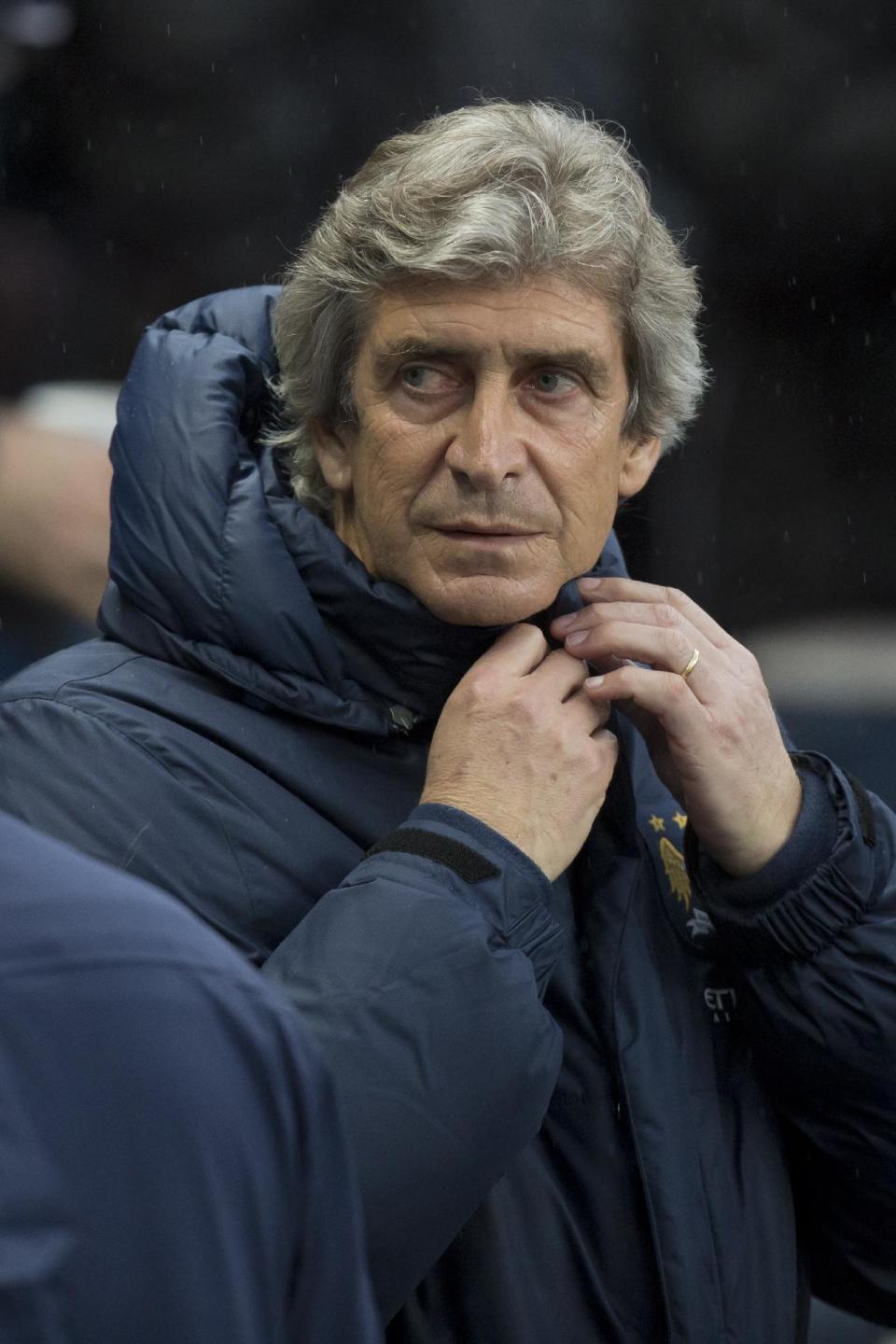 Manchester City's manager Manuel Pellegrini takes to the touchline before his team's English Premier League soccer match against Aston Villa at the Etihad Stadium, Manchester, England, Wednesday May 7, 2014. (AP Photo/Jon Super)