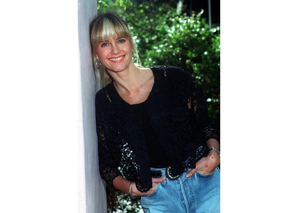 FILE - Olivia Newton-John appears during an interview in Los Angeles in December 1990. Newton-John, a longtime resident of Australia whose sales topped 100 million albums, died Monday at her southern California ranch, John Easterling, her husband, wrote on Instagram and Facebook.She was 73. (AP Photo/Julie Parkes, File)