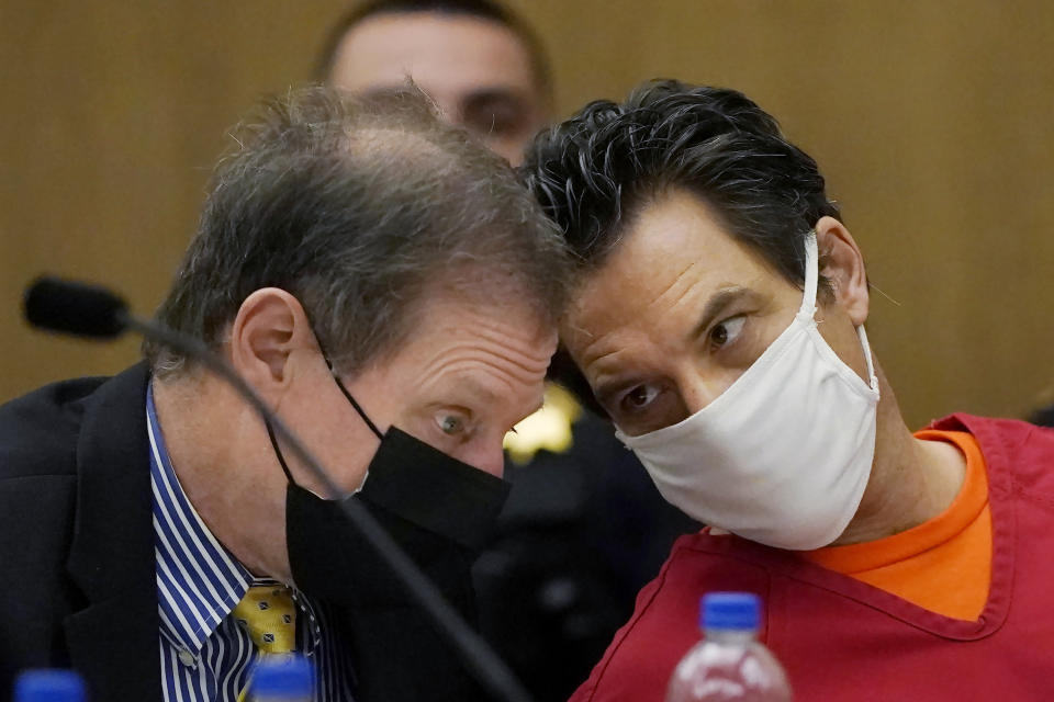 Scott Peterson, right, talks with attorney Cliff Gardner during a hearing at the San Mateo County Superior Court in Redwood City, Calif., Monday, Feb. 28, 2022. In 2004, Peterson was convicted of the murders of his wife, Laci Peterson, 27, who was eight months pregnant, and of the unborn son they planned to name Conner. (AP Photo/Jeff Chiu, Pool)