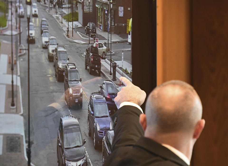 Connecticut State Police Sgt. Kevin Duggan points to the area where evidence was recovered on Albany Avenue in Hartford as he testifies on day eight of Michelle Troconis' criminal trial at Connecticut Superior Court in Stamford, Conn. Tuesday, Jan. 23, 2024. Troconis is on trial for charges related to the disappearance and death of New Canaan resident Jennifer Dulos. (Tyler Sizemore/Hearst Connecticut Media via AP)