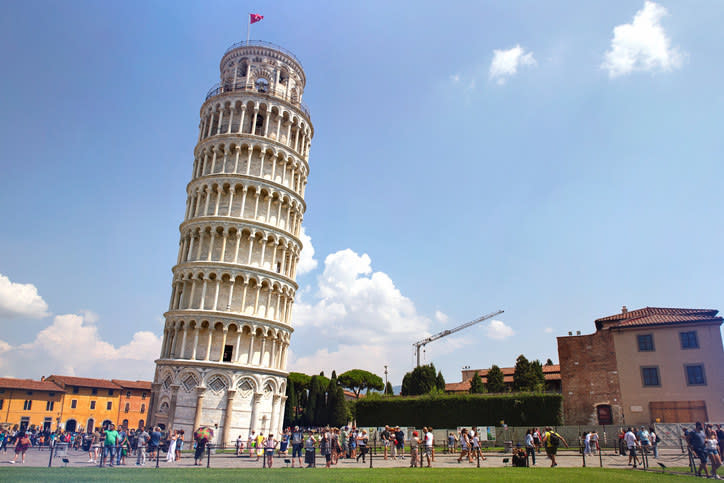 people walking around the tower