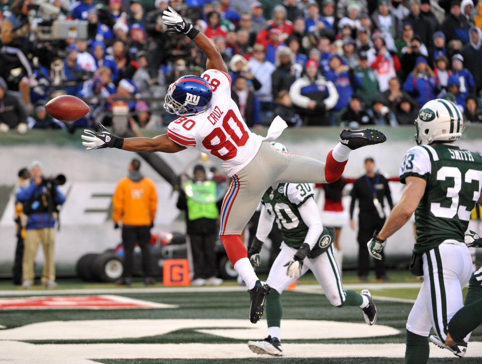 Victor Cruz #80 of the New York Giants reaches for a pass during the second half against the New York Jets on December 24, 2011 at MetLife Stadium in East Rutherford, New Jersey. (Photo by Christopher Pasatieri/Getty Images)