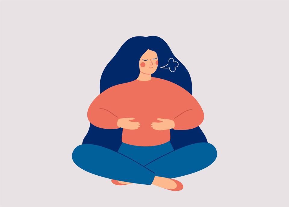 woman makes breathing exercise girl sits on the floor in pose lotus and makes a deep inhalation recovery respiratory system after illness health and wellbeing concept