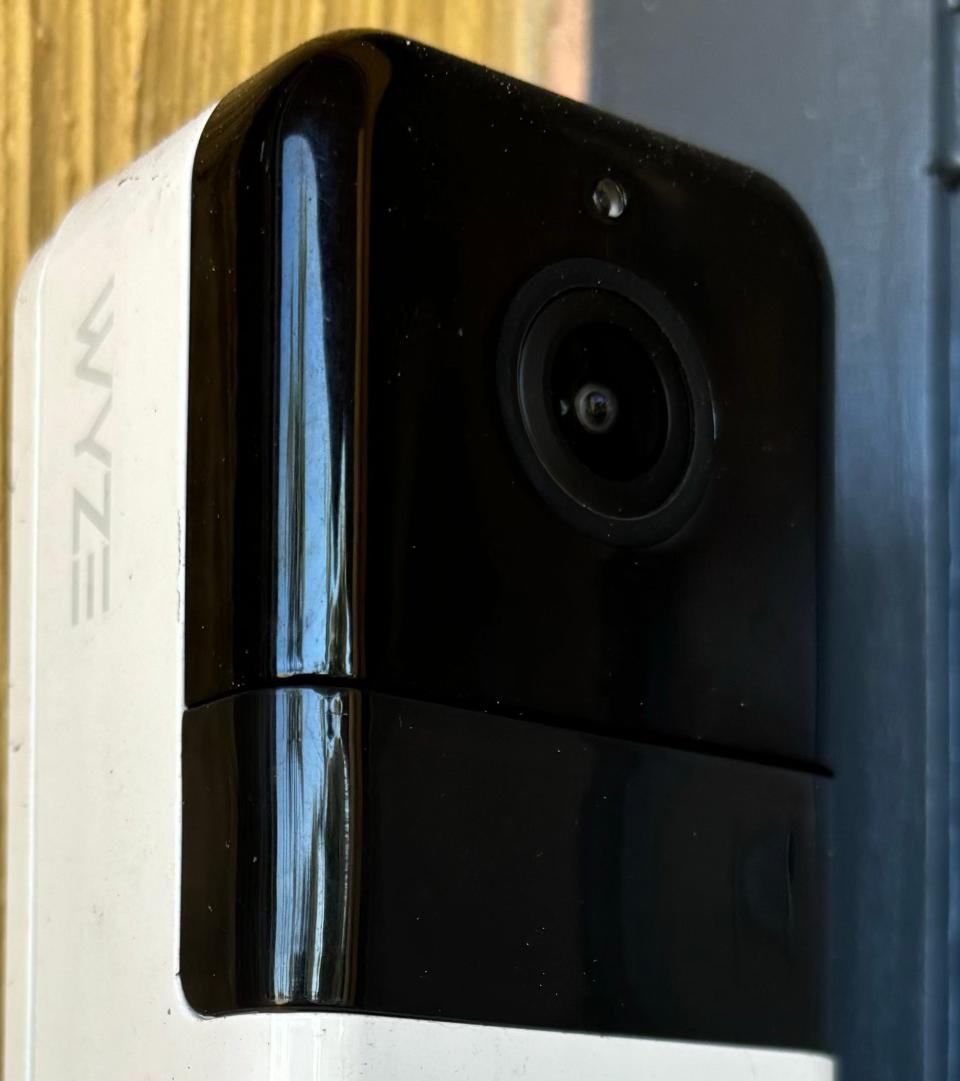 A Wyze doorbell camera is attached to the wall next to a user's front door.