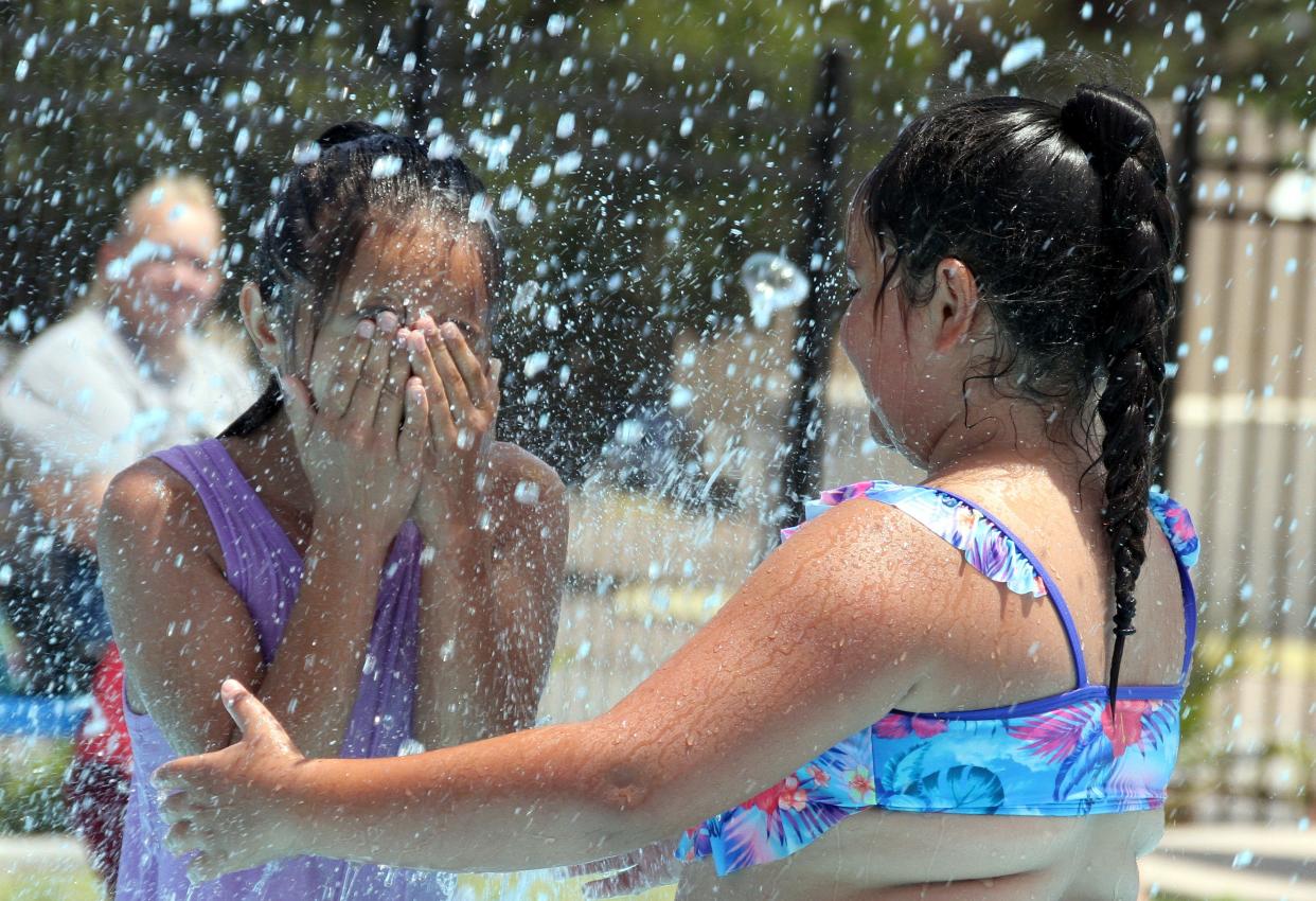 The Amistad Splash Pad continues to draw children and adults to cool off at Eighth and Spruce streets.