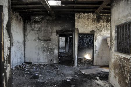 A burnt-out police station, that was destroyed by rioters during a farm laborers' strike in Baja California earlier this year, is seen in the neighborhood of New Copala in San Quintin, Mexico, November 19, 2015. REUTERS/Alasdair Baverstock