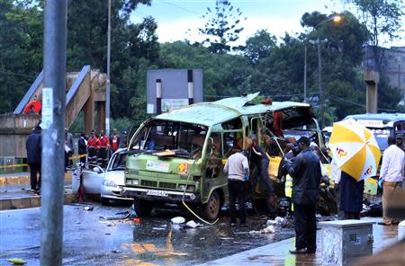 Damaged vehicles are seen at the scene of a blast near Pangani Police Station in Kenya's capital Nairobi, December 14, 2013. REUTERS/Noor Khamis