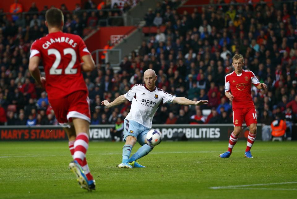 West Ham's James Collins (C) kicks the ball over the cross bar during their English Premier League soccer match against Southampton at St Mary's stadium in Southampton, southern England September 15, 2013.