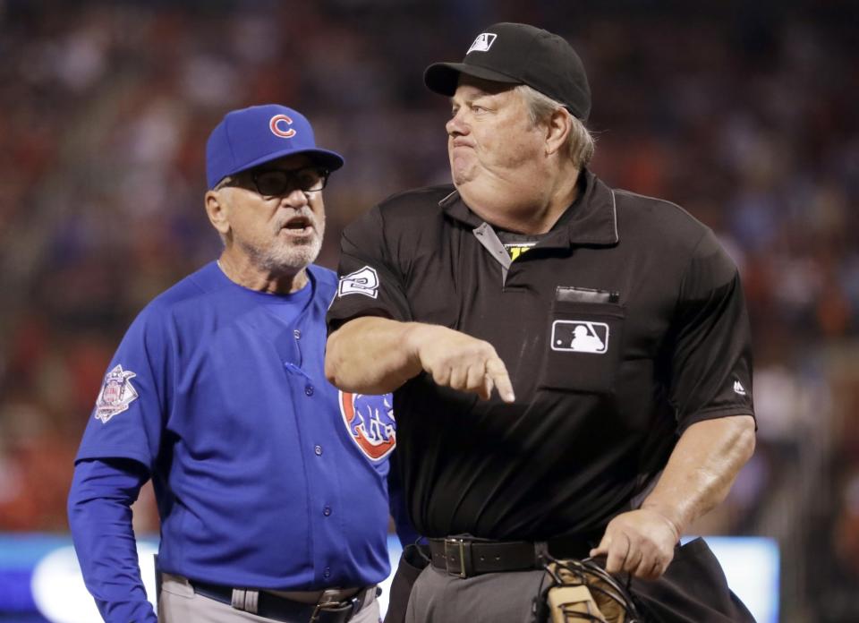 Chicago Cubs manager Joe Maddon, left, is ejected by home plate umpire Joe West during the ninth inning of a baseball game against the St. Louis Cardinals, Monday, Sept. 12, 2016, in St. Louis.